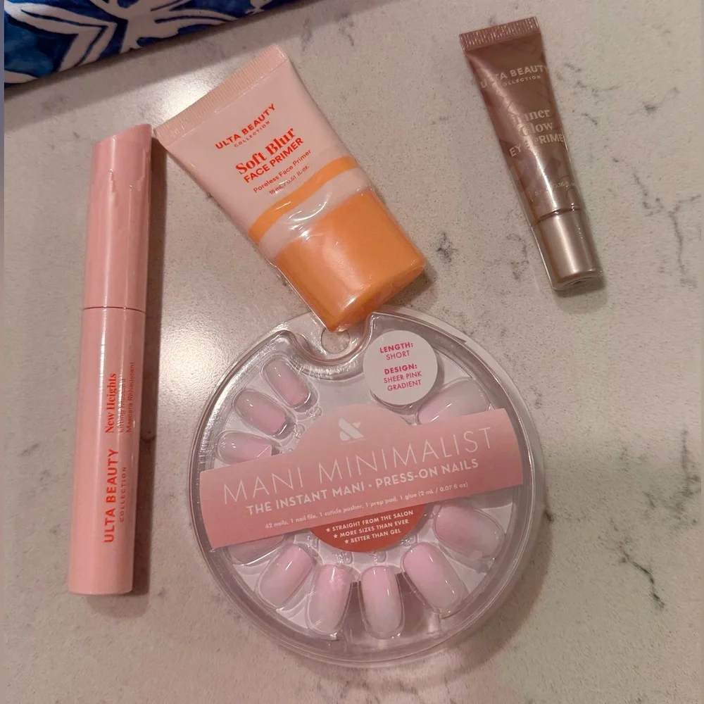 Blue and White Floral Pouch (Estee Lauder) with brand new sealed ulta products